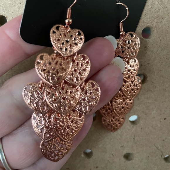 Bright copper mini heart earrings.